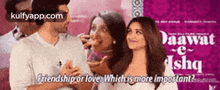 a group of people standing next to each other with the words `` friendship or love which is more important '' written above them .