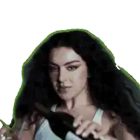 a woman with long hair is holding a brush