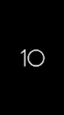 a black background with a white circle and the number 10 on it .