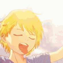 a boy with yellow hair is sticking out his tongue