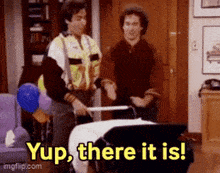 two men are standing next to each other and one of them is pushing a stroller while the other says yup there it is