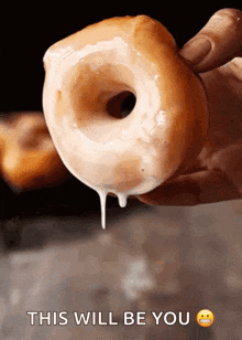 a person is holding a glazed donut in their hand with the words this will be you written below it