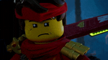 a lego figure with a red scarf around his head