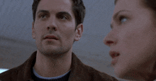 a man and woman are looking at each other and the woman says well