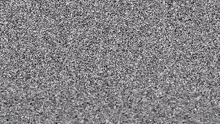 a black and white photo of a gray carpet with a lot of small stones .