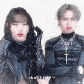 a man and a woman are standing next to each other and their shirts say misbhv