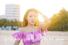 a woman in a pink off the shoulder top with the words girls who are going to be okay behind her