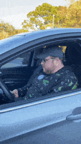 a man wearing a sweater that says rick and morty on it