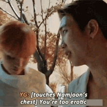 two men are standing next to each other and one of them says " touches namjoon 's chest "