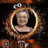 an elderly woman with glasses is smiling in a circle of fire with the words co hctf below her