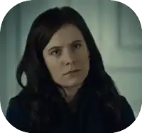 a close up of a woman 's face with dark hair