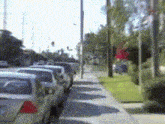 a row of cars parked on the side of a street