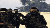 a group of soldiers wearing skull masks and holding guns with the words veed.io below them