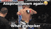 two men are fighting in a cage with the words asspinall down again what a shocker on the bottom