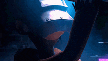a man wearing a welding helmet with sparks coming out of it in a dark room