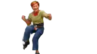 a woman in a green shirt and blue jeans is dancing