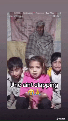 a group of children are sitting in front of a man with the caption " unc ain t clapping "