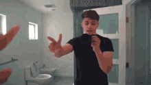 Peace Out Singing On The Mirror GIF - Peace Out Singing On The Mirror Filming GIFs