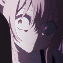 a close up of a person 's face with pink hair and purple eyes