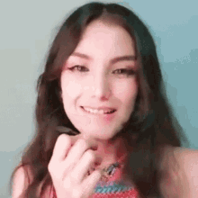 a close up of a woman 's face with a tooth missing and smiling .