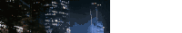 a blurry photo of a city at night with a white background