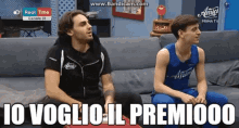 two men sitting on a couch with the words " io voglio il premioo " written below them