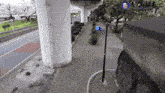 a man sits on a bench under a bridge with a sign that says ' samurai ' on it