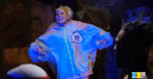 a person wearing a blue jacket that says yo on it