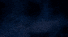 a dark blue background with a light coming out of it