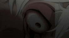 a close up of a person 's eyes with blood coming out of it