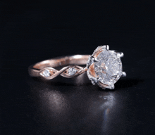 a close up of a diamond ring on a table