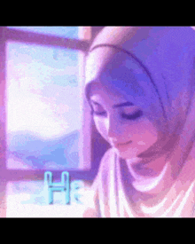 a woman wearing a hijab is sitting in front of a window with the word he written in blue