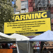 a sign that says warning on it in yellow