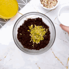 a glass bowl filled with chocolate and pistachios with the word pistachio on the bottom