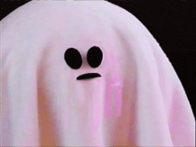 a pink ghost with black eyes and a mustache on its face