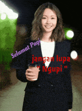 a woman in a suit is holding a cup of coffee with the words selamat pagi jangan lupa ngupi