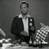 a man holds a bottle of nuka cola