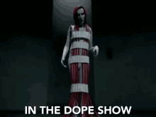 in the dope show standing still red gown weird forms the dope show