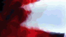 a red white and blue background with a blurred image