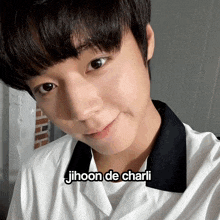 a close up of a person 's face with jihoon de charli written on the bottom right