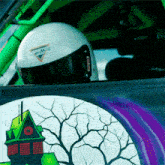 a person wearing a helmet that says ' smith ' on it is sitting in a car