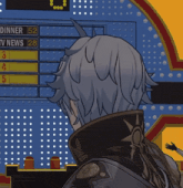 a man stands in front of a scoreboard that says dinner 52 tv news 28 and 3 4 5