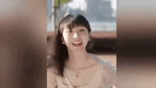 a close up of a woman smiling with her mouth open .