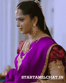 a woman in a purple saree with the words starttamilchat.in