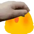 a person is holding a yellow rubber duck with a red nose .