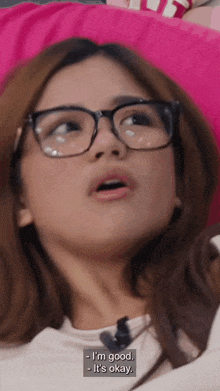 a woman wearing glasses says i 'm good