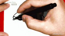 a hand is holding a pen in front of a screen that says " draw cute things "