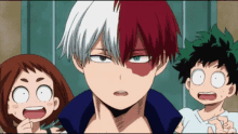 a boy with red and white hair is standing next to two girls