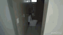 a toilet in a bathroom with the words made in animatica on the bottom