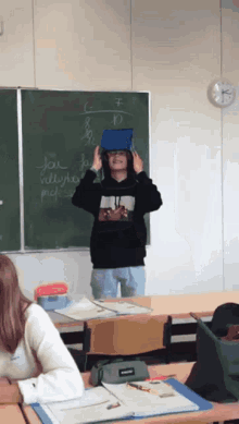 a person in front of a blackboard that says jae